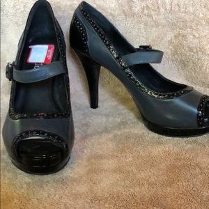 Gray and black pumps